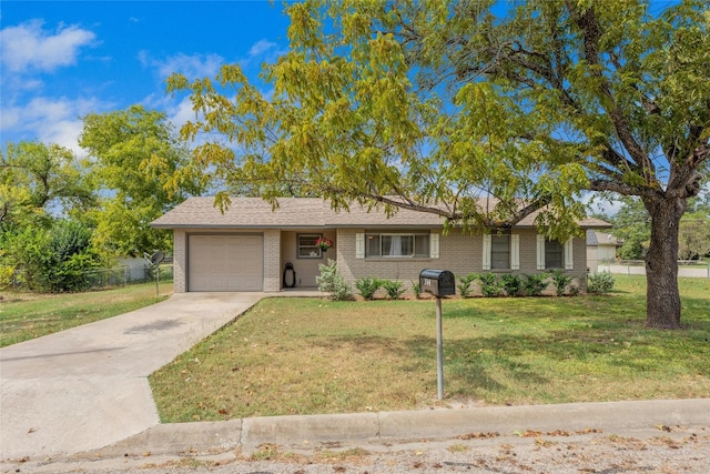 single story home featuring a front lawn and a garage