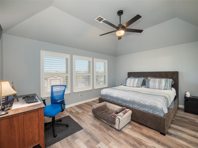 bedroom featuring ceiling fan, hardwood / wood-style flooring, and lofted ceiling