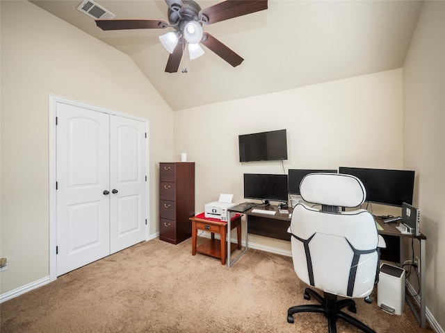 carpeted office with lofted ceiling and ceiling fan