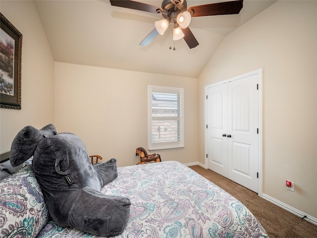 bedroom featuring a closet, carpet, ceiling fan, and vaulted ceiling