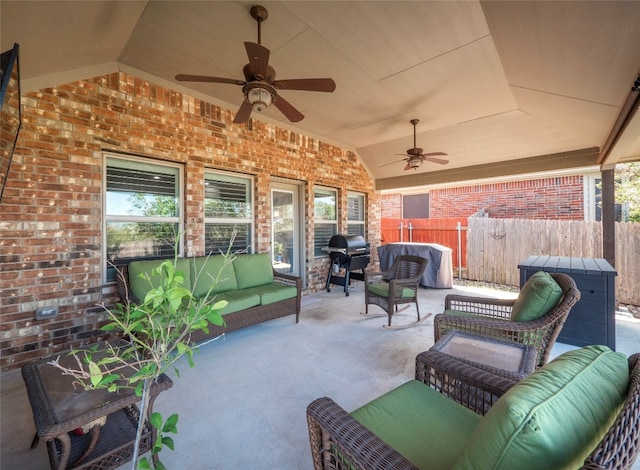 view of patio with area for grilling, outdoor lounge area, and ceiling fan