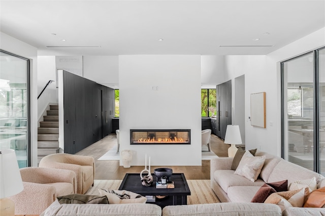 living room featuring light hardwood / wood-style flooring and plenty of natural light