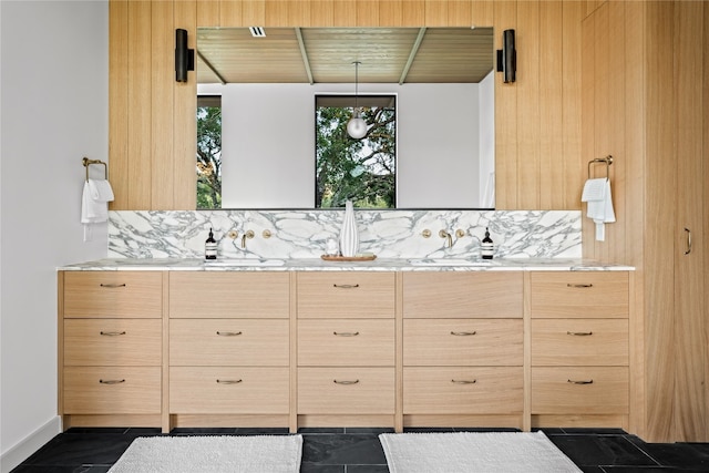 interior space featuring vanity, tasteful backsplash, and tile patterned floors