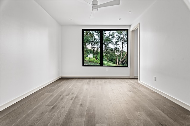 unfurnished room with light hardwood / wood-style flooring and ceiling fan