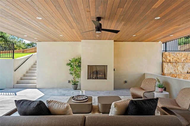 2400 Trail Of The Madrones, Austin, TX 78746 - view of patio / terrace with stairway, a ceiling fan, and an outdoor living space with a fireplace
