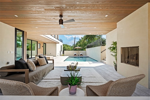 view of swimming pool with ceiling fan