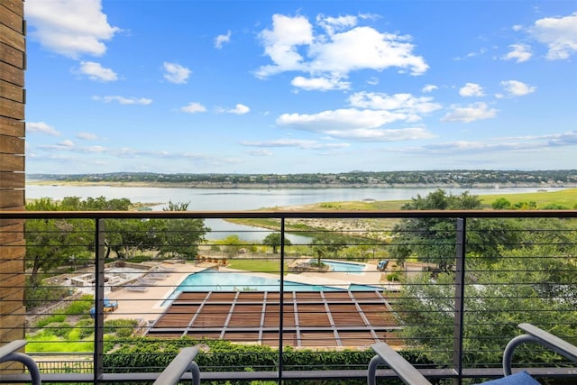 balcony featuring a water view