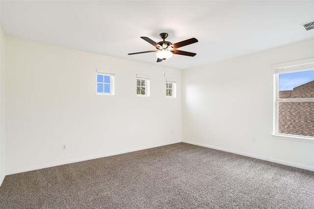 empty room with carpet flooring and ceiling fan