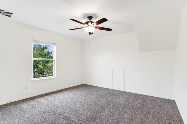 spare room featuring ceiling fan and carpet flooring