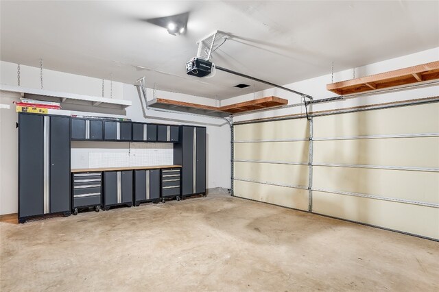 garage featuring a garage door opener