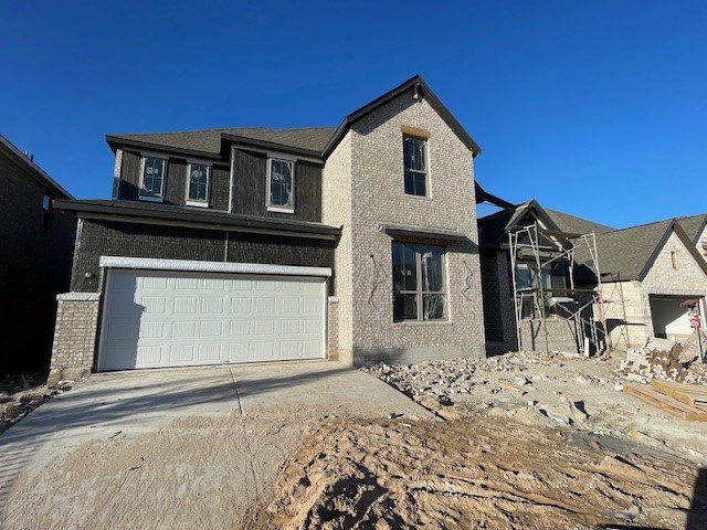 view of front of property featuring a garage