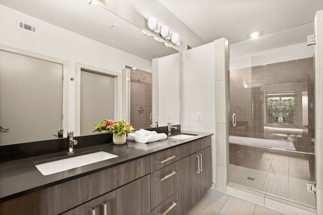 bathroom with vanity, tile patterned flooring, and separate shower and tub