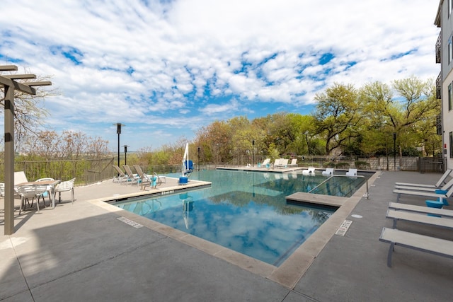 view of swimming pool featuring a patio