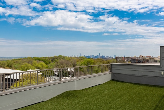 view of yard featuring a balcony