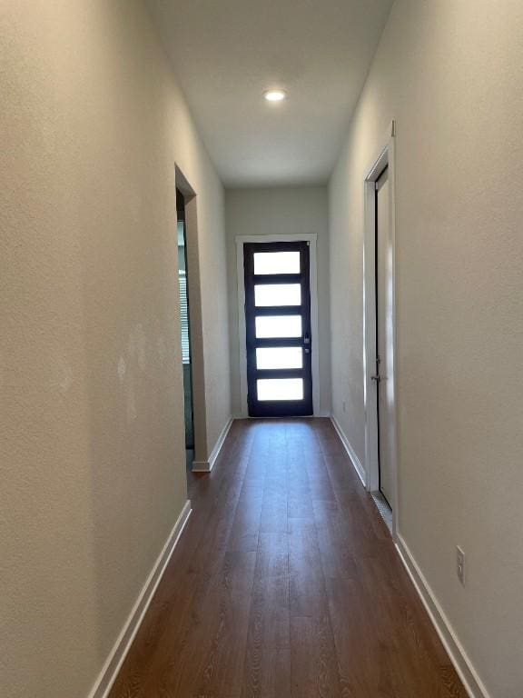 2421 Rosette Ln, Leander, TX 78641 - doorway featuring dark wood finished floors and baseboards