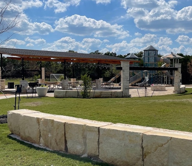 view of community with a playground and a yard