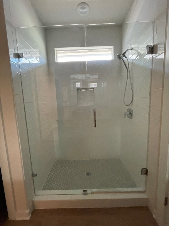 bathroom with an enclosed shower