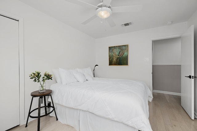 bedroom featuring light hardwood / wood-style floors and ceiling fan