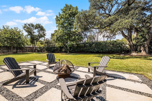 view of patio with a fire pit