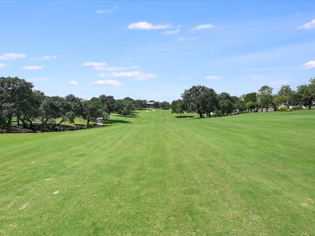 surrounding community featuring a lawn