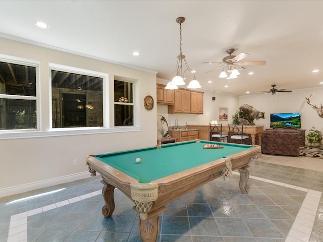 rec room with ceiling fan, light tile patterned flooring, ornamental molding, and billiards