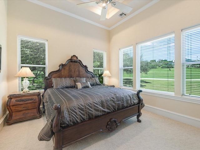 bedroom featuring ceiling fan, light colored carpet, and ornamental molding