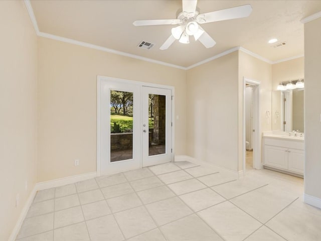 tiled spare room with ceiling fan, french doors, sink, and ornamental molding