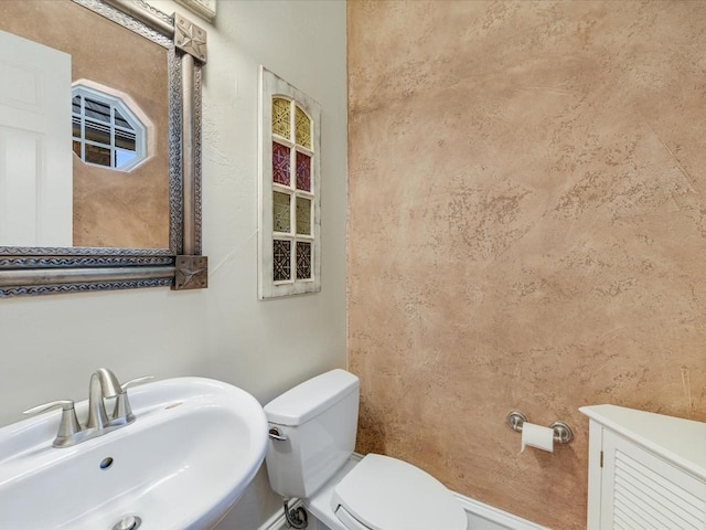 bathroom with sink and toilet