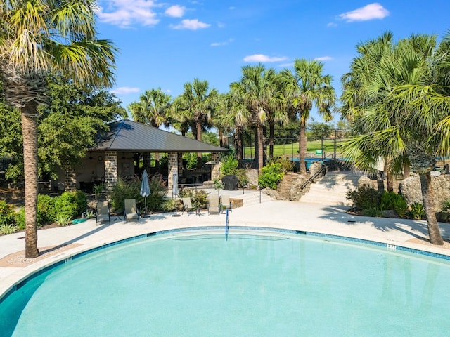 view of swimming pool featuring a gazebo and a patio