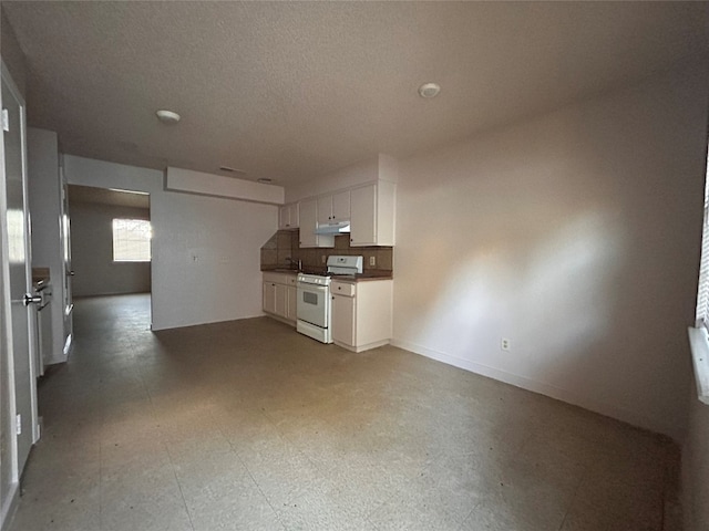 interior space with a textured ceiling and sink