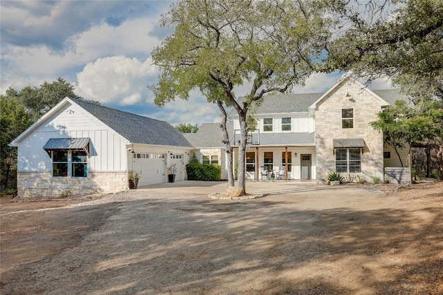 modern farmhouse style home featuring a garage