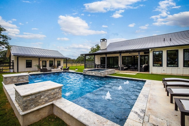 view of pool with a patio, a yard, an in ground hot tub, and pool water feature