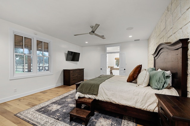 bedroom with ceiling fan and light hardwood / wood-style flooring