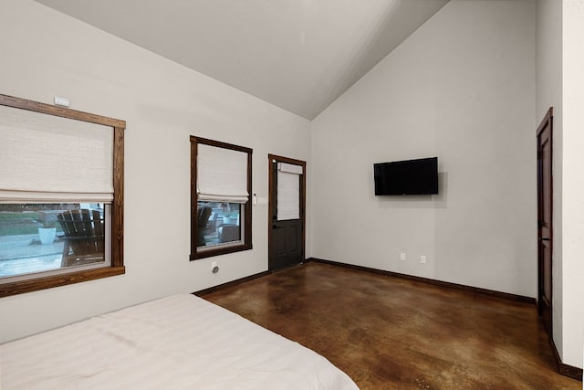 unfurnished bedroom featuring lofted ceiling