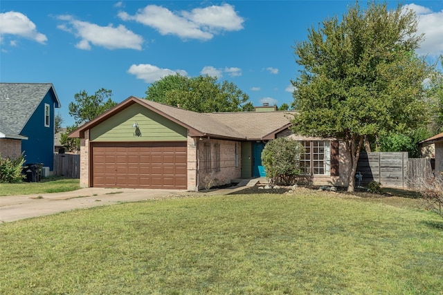 single story home with a garage and a front lawn