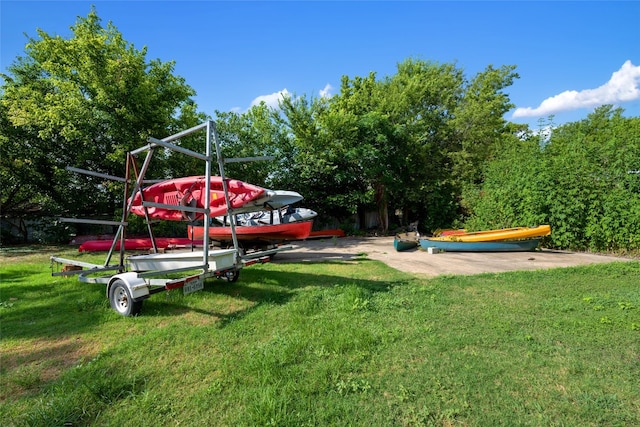 view of playground with a lawn