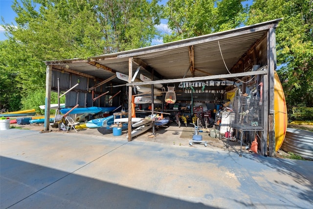 view of patio featuring an outbuilding