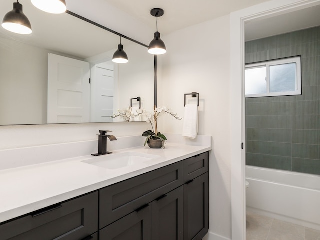 full bathroom with tile patterned floors, vanity, toilet, and tiled shower / bath