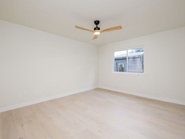 unfurnished room with light wood-type flooring and ceiling fan