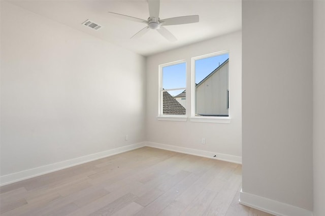 unfurnished room featuring ceiling fan and light wood-type flooring