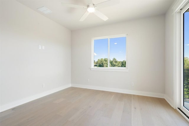 unfurnished room featuring ceiling fan, a healthy amount of sunlight, and light wood-type flooring