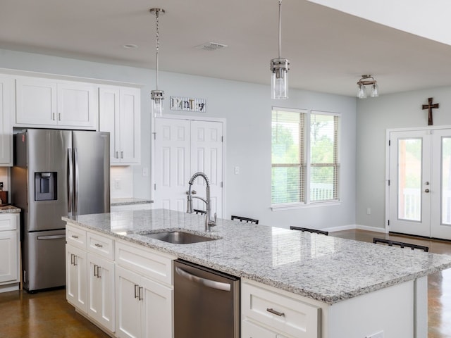 kitchen with white cabinetry, appliances with stainless steel finishes, and sink