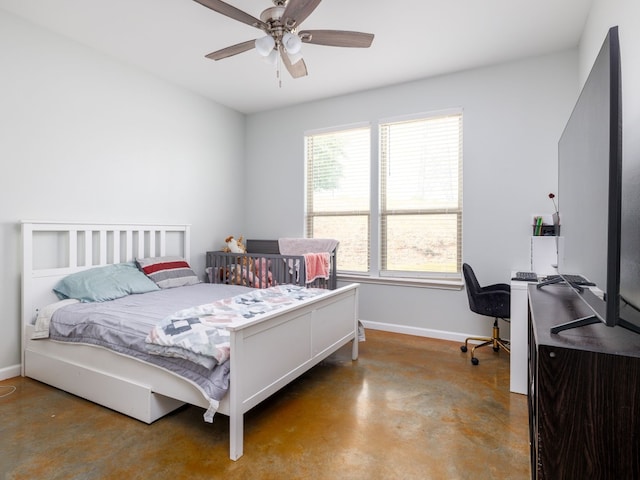 bedroom featuring ceiling fan and concrete floors