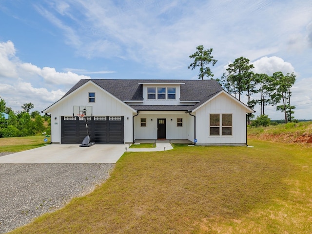 modern farmhouse with a front lawn and a garage