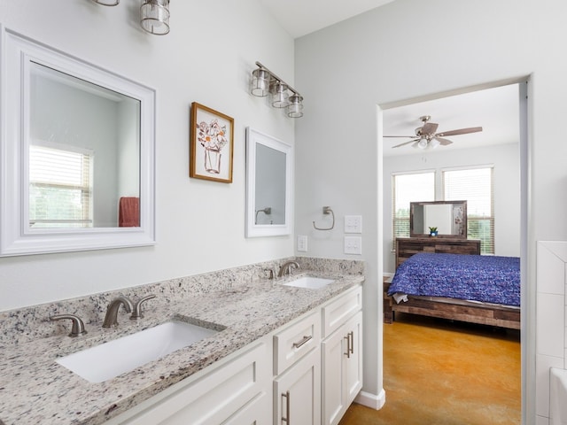 bathroom with ceiling fan and vanity