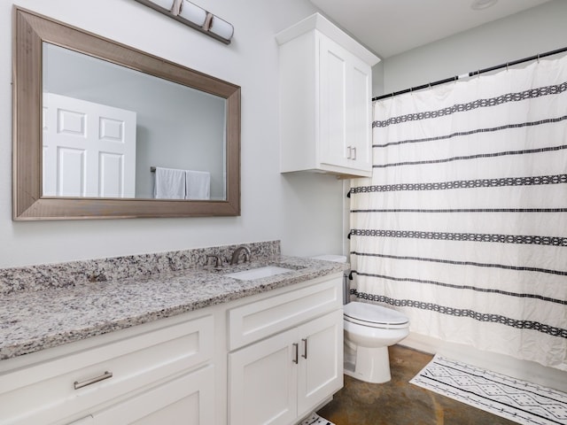 bathroom with walk in shower, vanity, and toilet