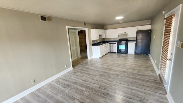 kitchen featuring white cabinets, sink, light hardwood / wood-style floors, and black appliances