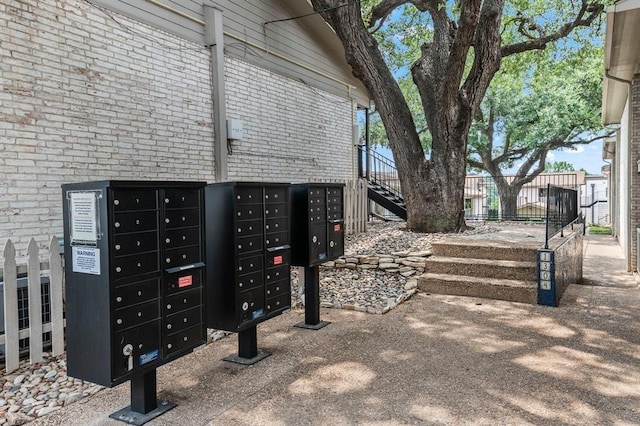 1304 Summit St Unit 206, Austin, TX 78741 - view of home's community featuring fence, stairs, and mail area