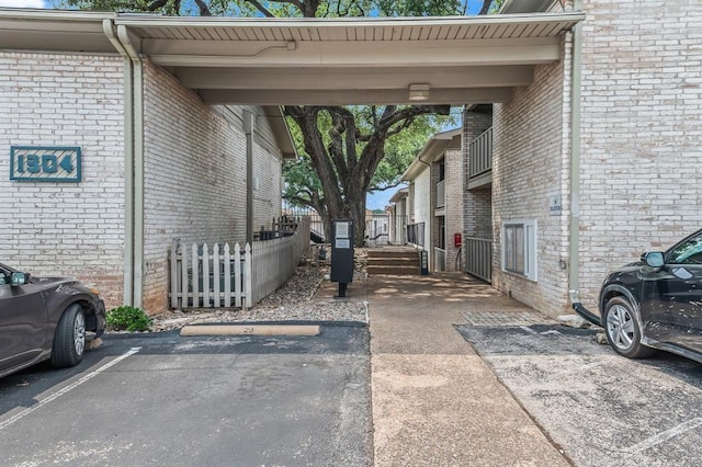 1304 Summit St Unit 206, Austin, TX 78741 - uncovered parking lot with fence
