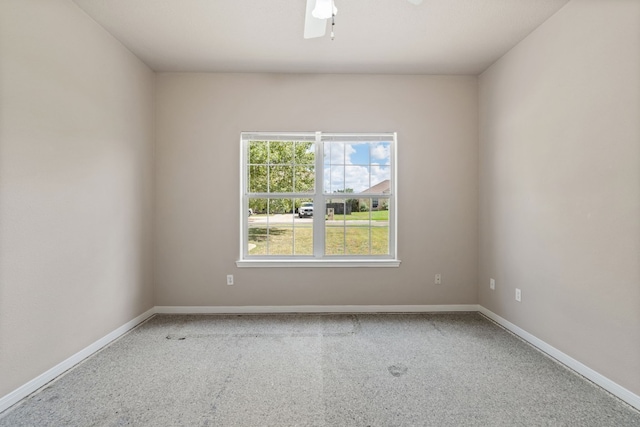 carpeted empty room with ceiling fan